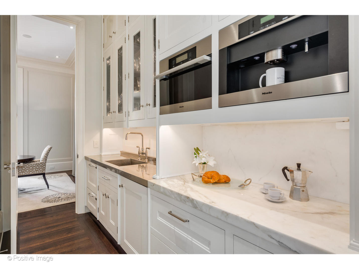 1853 North Burling Street Chicago, IL 60614 - Photo 29 of 86 a kitchen with stainless steel appliances granite countertop a sink and cabinets