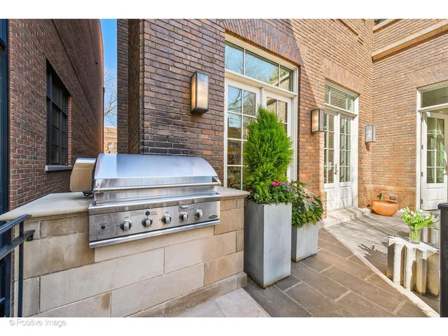 a kitchen with a sink a stove and cabinets