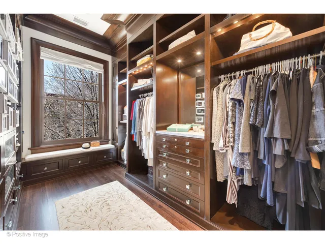 a bathroom with a granite countertop sink a toilet a shower and a mirror