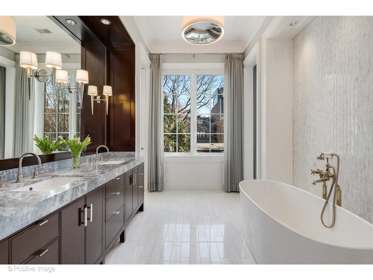 1853 North Burling Street Chicago, IL 60614 - Photo 55 of 86 a en suite bathroom with a granite countertop sink and a mirror