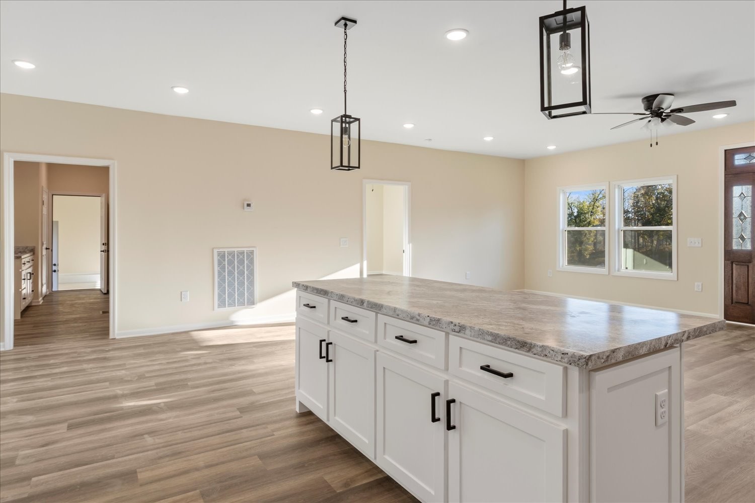 975 Weakley Creek Road Lawrenceburg, TN 38464 - Photo 14 of 49 a kitchen with stainless steel appliances granite countertop a sink dishwasher and a wooden floor
