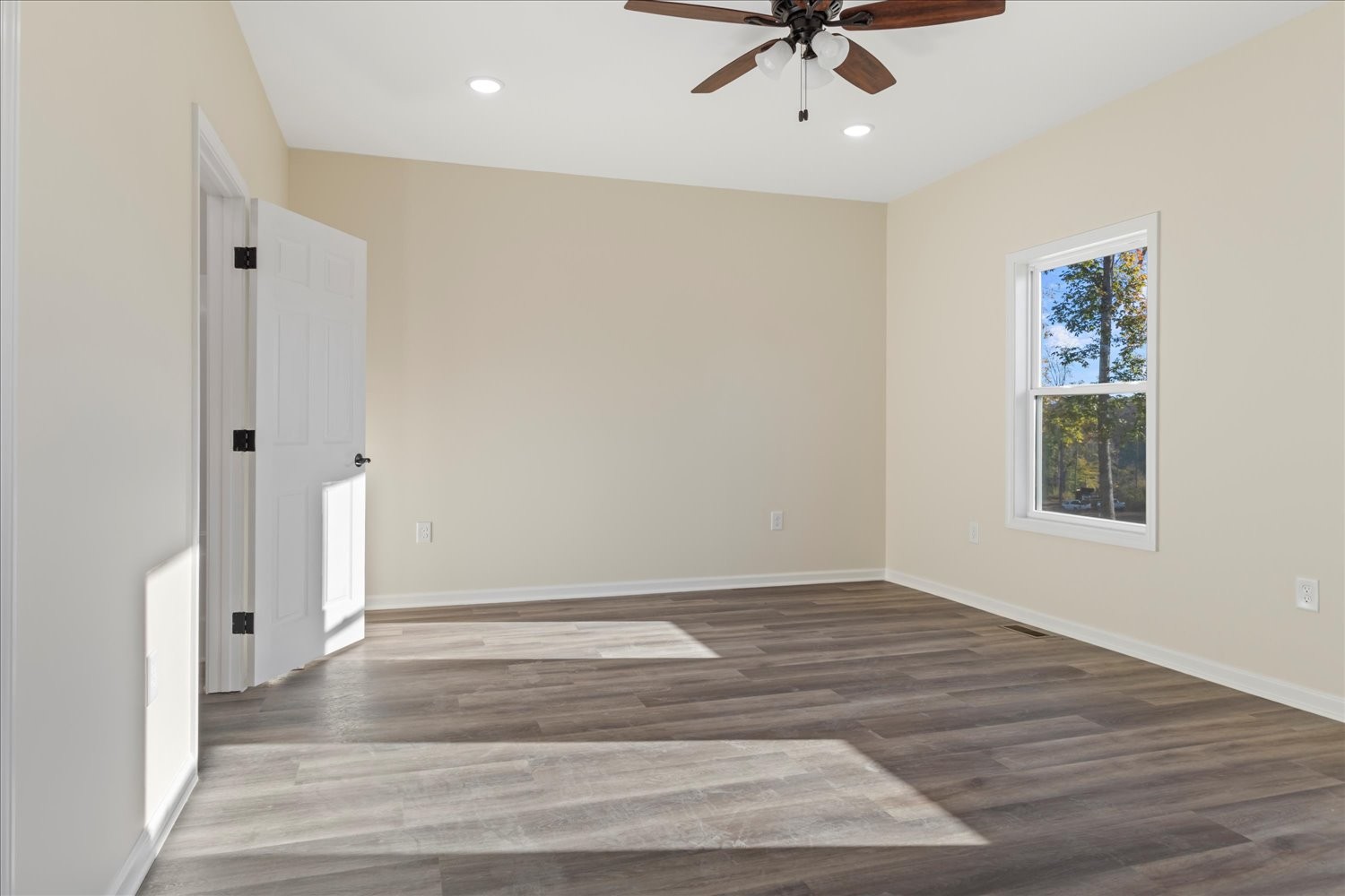 975 Weakley Creek Road Lawrenceburg, TN 38464 - Photo 15 of 49 wooden floor in an empty room with a window