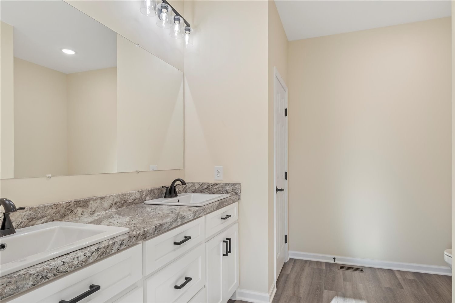 975 Weakley Creek Road Lawrenceburg, TN 38464 - Photo 18 of 49 a bathroom with a granite countertop sink and a mirror