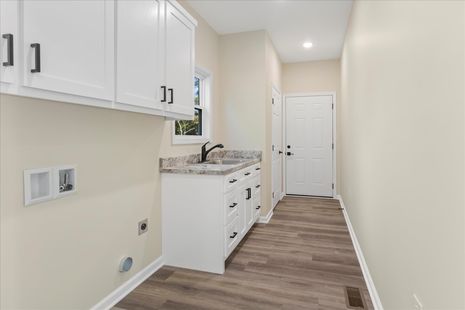 975 Weakley Creek Road Lawrenceburg, TN 38464 - Photo 27 of 49 a kitchen with white cabinets and white appliances