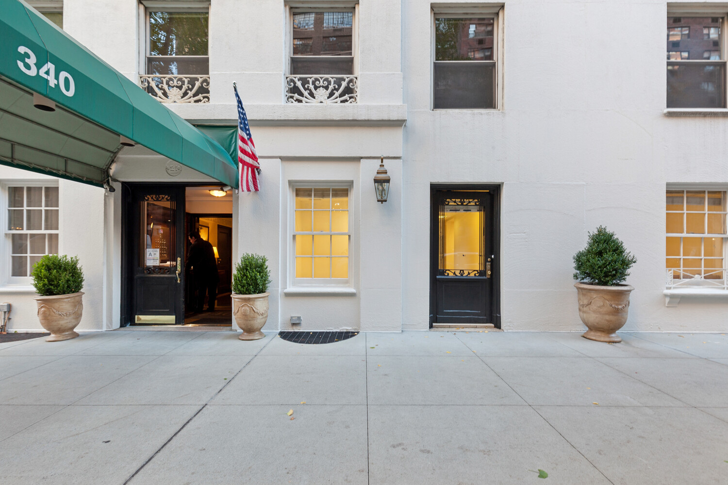 a view of a entryway door with brick walls