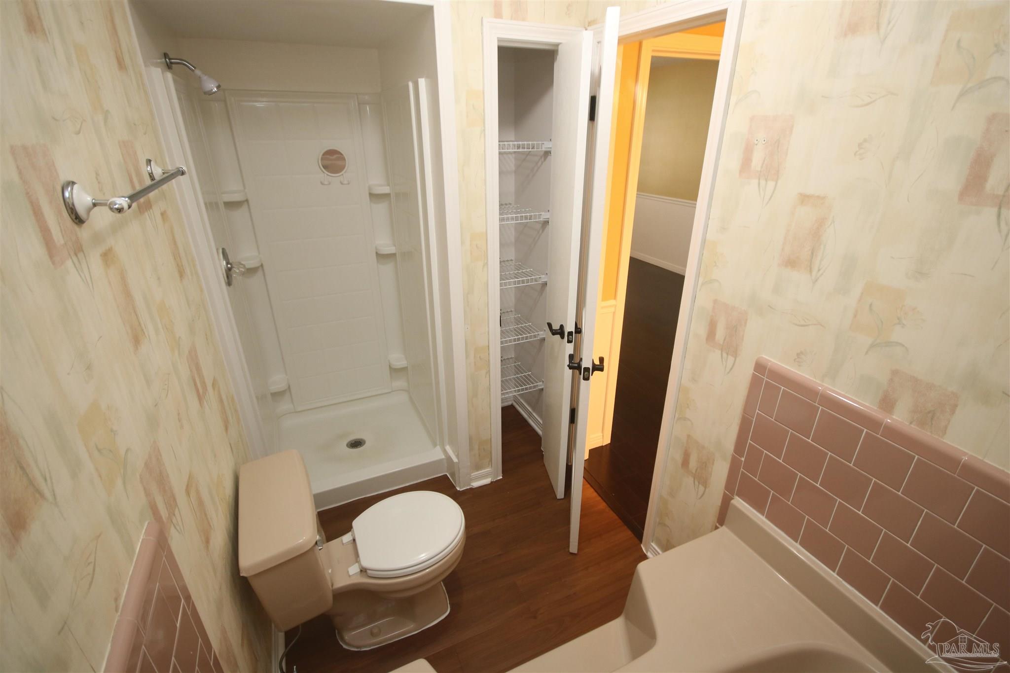 5464 Rowe Trail Pace, FL 32571 - Photo 16 of 50 toilet & tub area. Vanity outside door to the R.