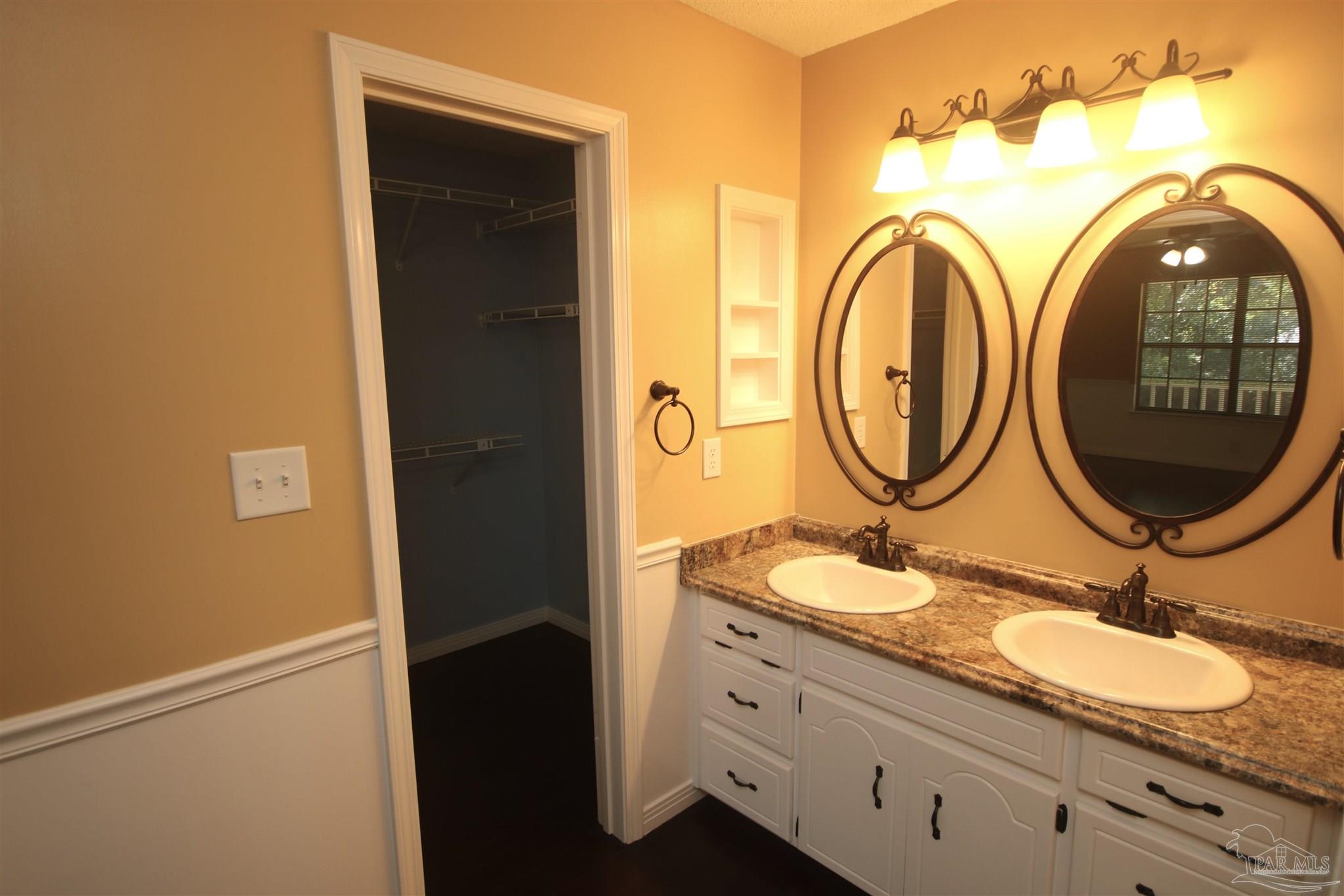 5464 Rowe Trail Pace, FL 32571 - Photo 17 of 50 mirrors & faucets 2015. Walk-in closet to the left
