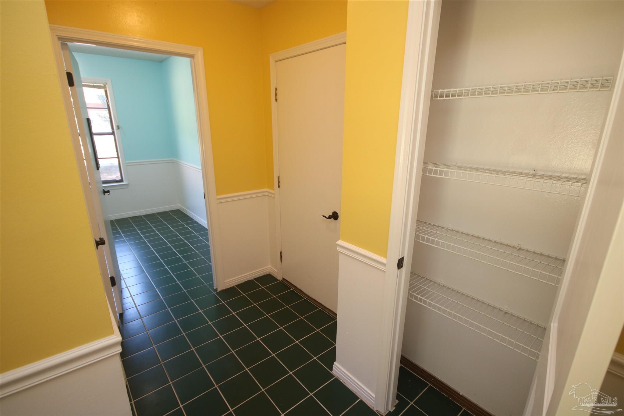 5464 Rowe Trail Pace, FL 32571 - Photo 25 of 50 1/2 bath, laundry room & access to garage.