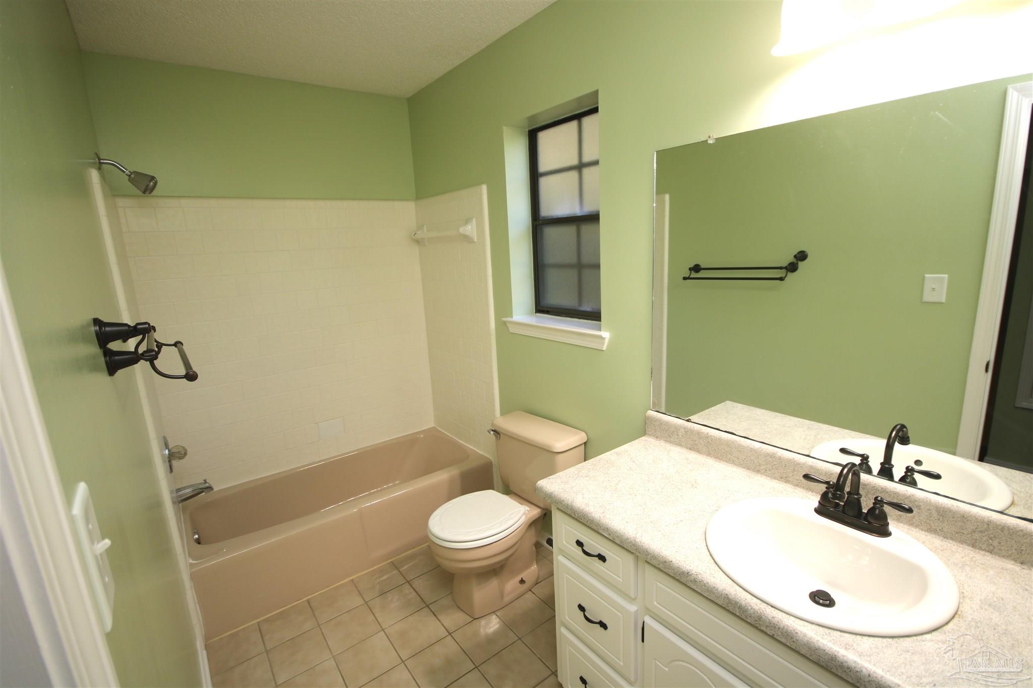 5464 Rowe Trail Pace, FL 32571 - Photo 33 of 50 Countertop, sink, faucets, light & mirror.