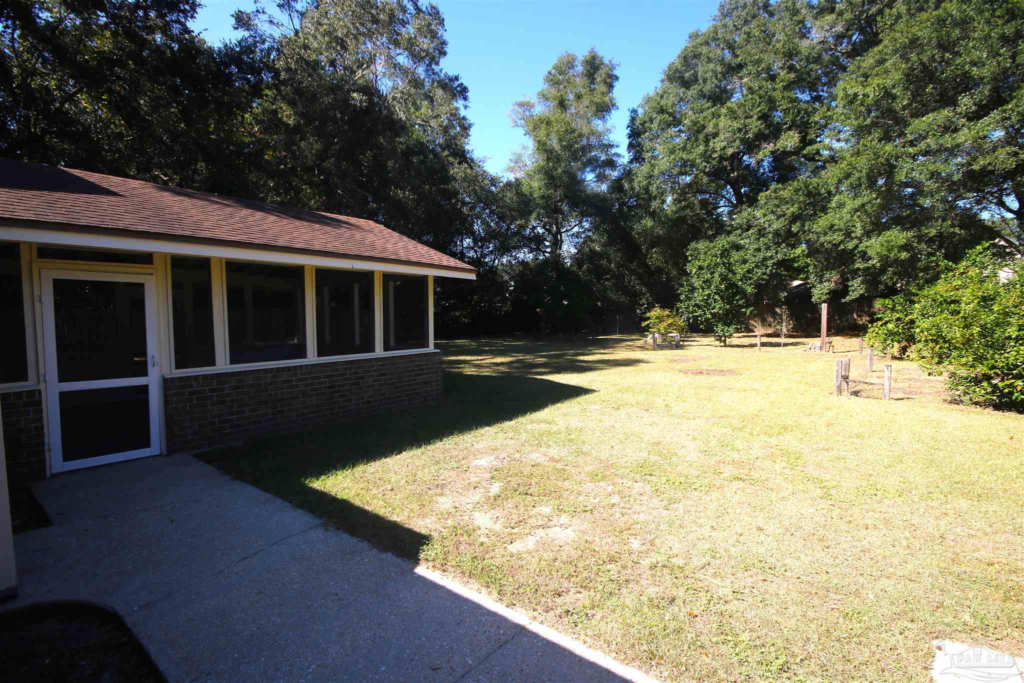 5464 Rowe Trail Pace, FL 32571 - Photo 45 of 50 screened patio & kitchen is perfect for grilling.