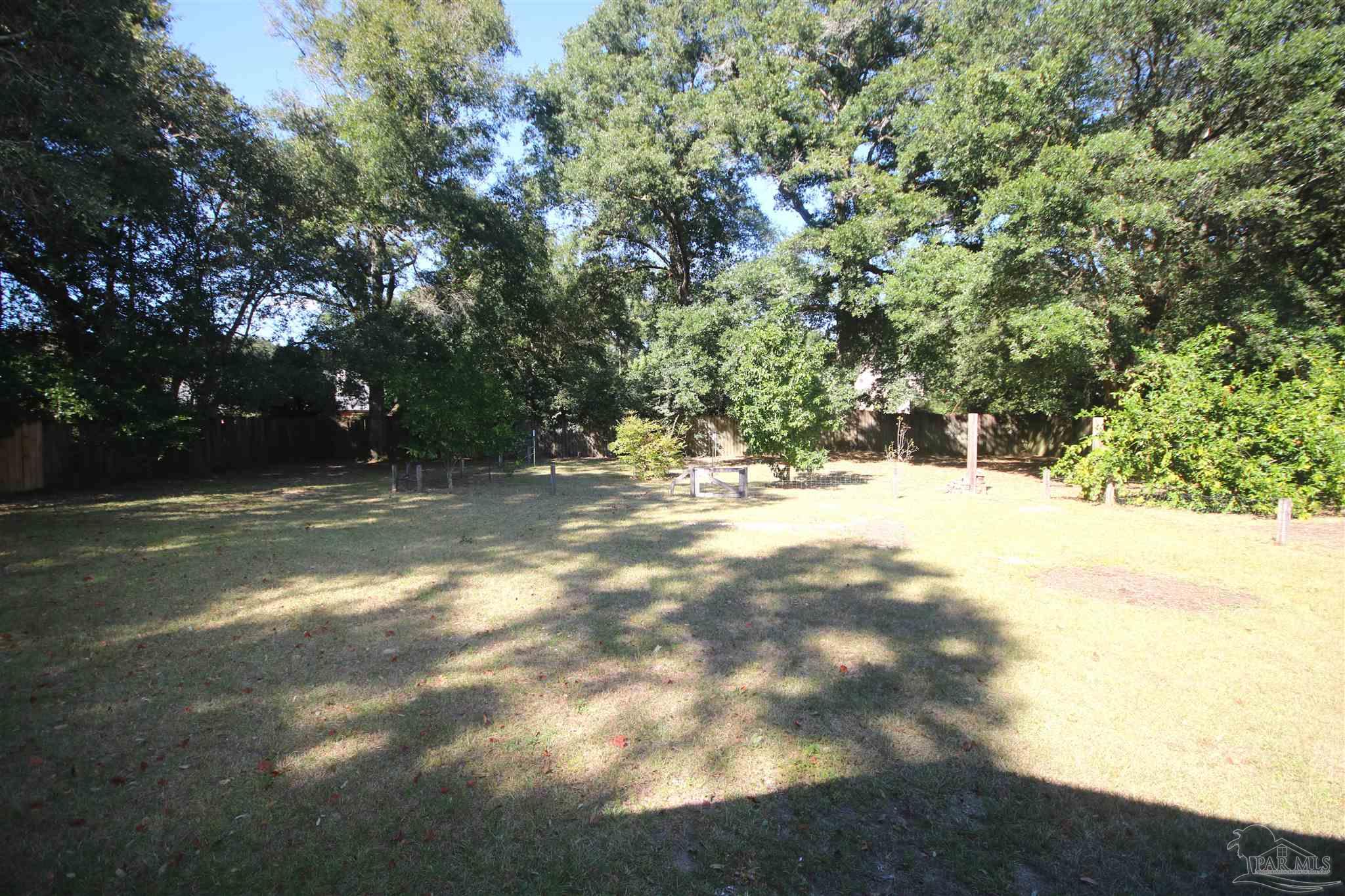 5464 Rowe Trail Pace, FL 32571 - Photo 49 of 50 fenced in with a 6' wood privacy fence.
