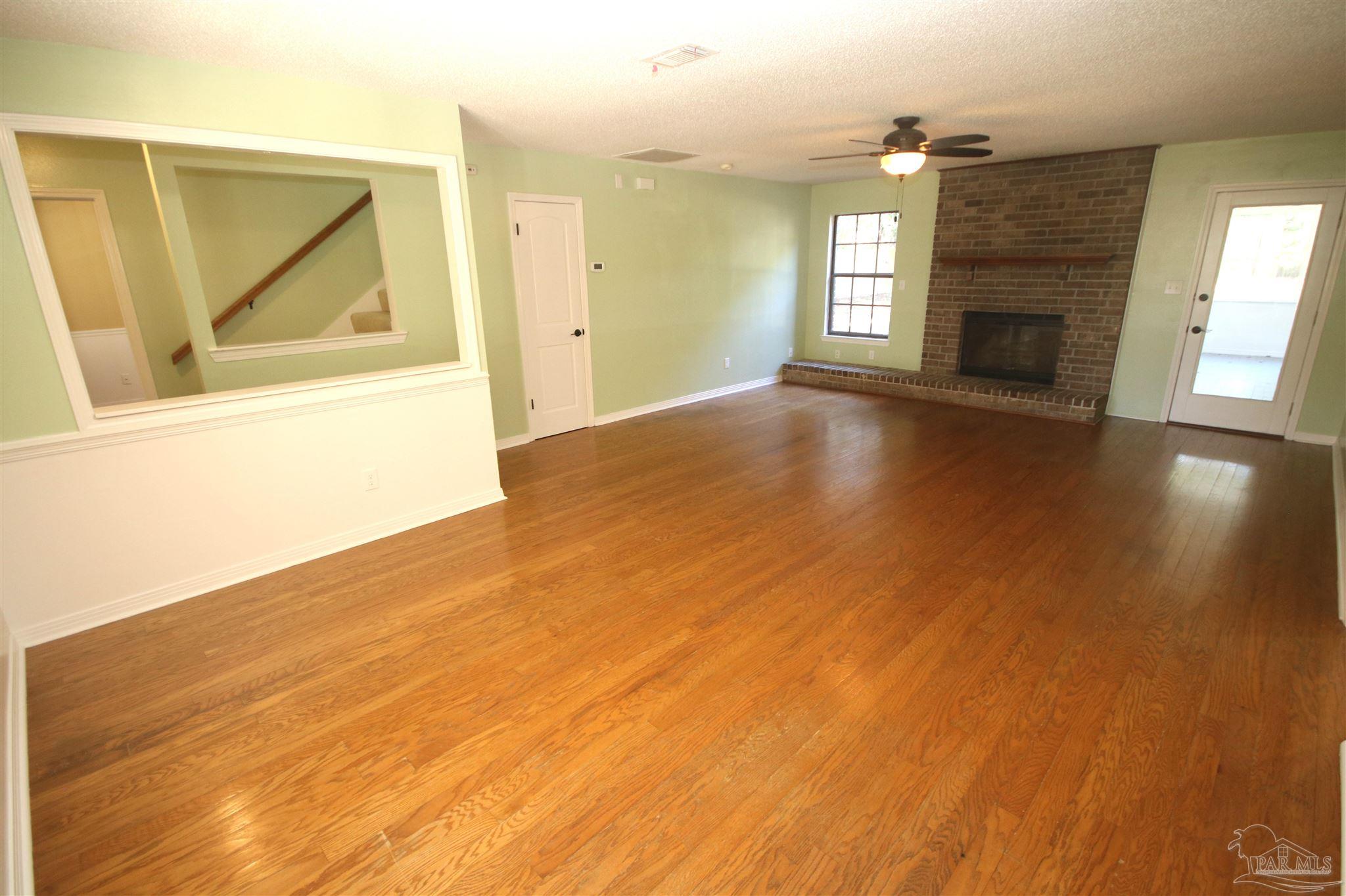 5464 Rowe Trail Pace, FL 32571 - Photo 6 of 50 Brick fireplace with raised hearth.