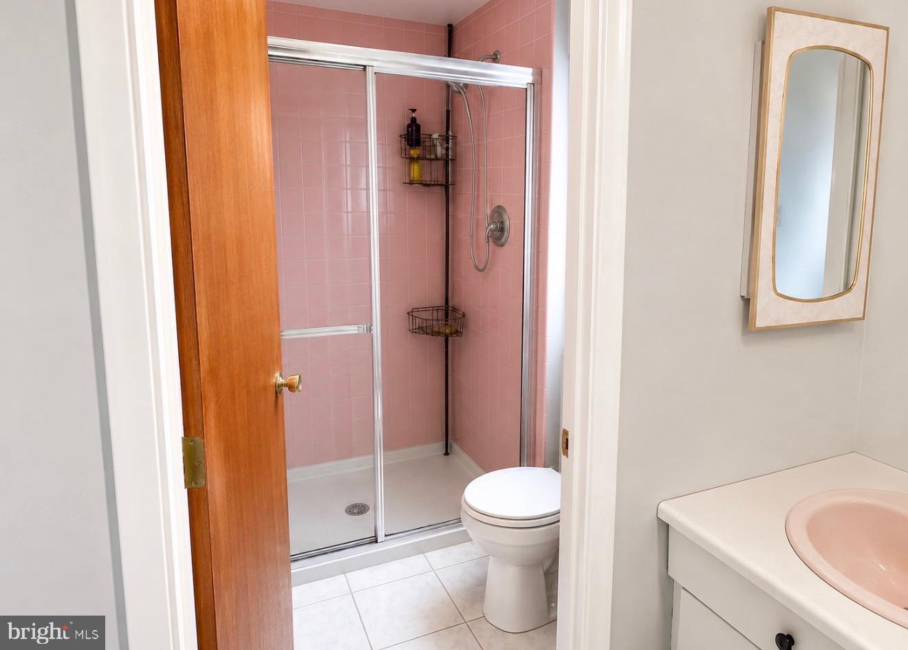 8520 Bridle Road Philadelphia, PA 19111 - Photo 10 of 14 Charming pink-tiled bathroom retreat.
