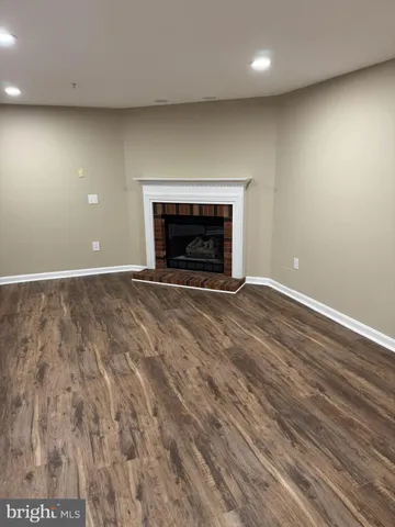an empty room with a fireplace