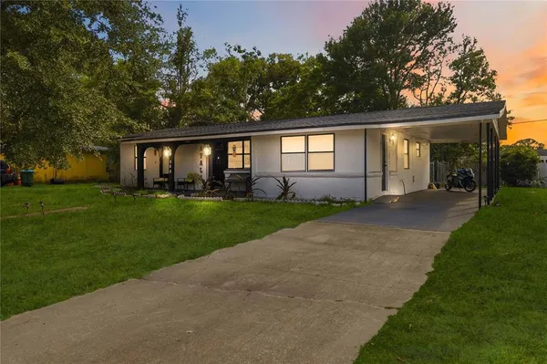 front view of a house with a yard