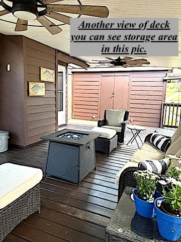 a view of a balcony with furniture