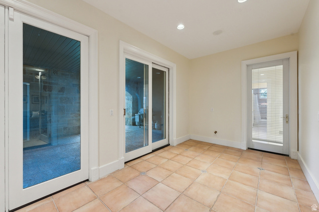 1714 Ridge Point Drive Bountiful, UT 84010 - Photo 86 of 132 Terracotta-style tile flooring, recessed ceiling lighting, and multiple glass-paneled doors