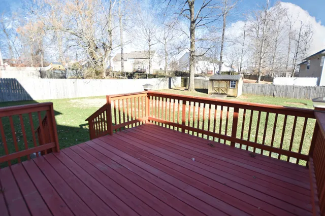 a view of balcony with wooden floor