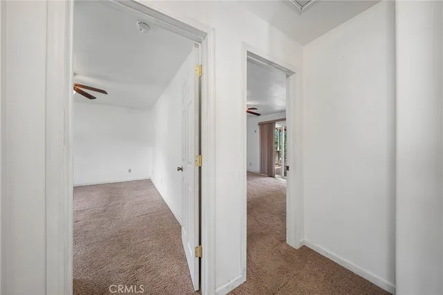an aerial view of a house with a yard and large tree