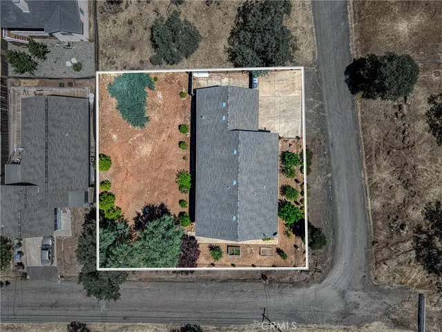 a wooden bench sitting in front of a house
