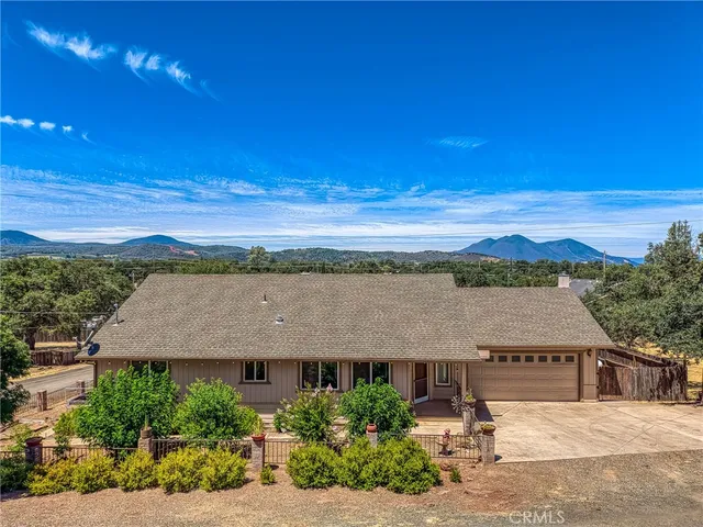 an aerial view of a house with a garden