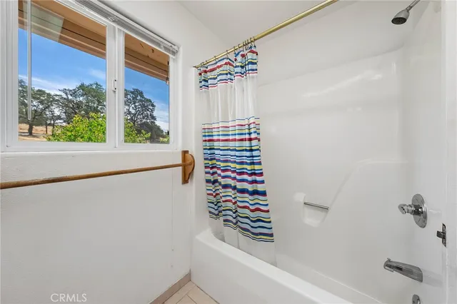 a backyard of a house with plants and trees