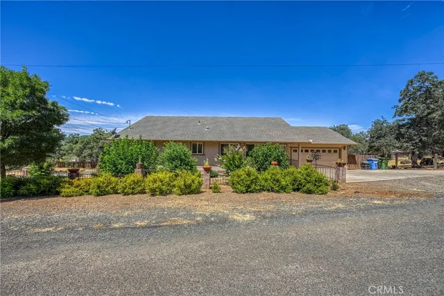 an empty room with windows and ceiling fan