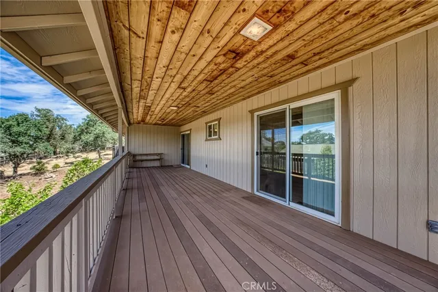 a view of a balcony with wooden floor