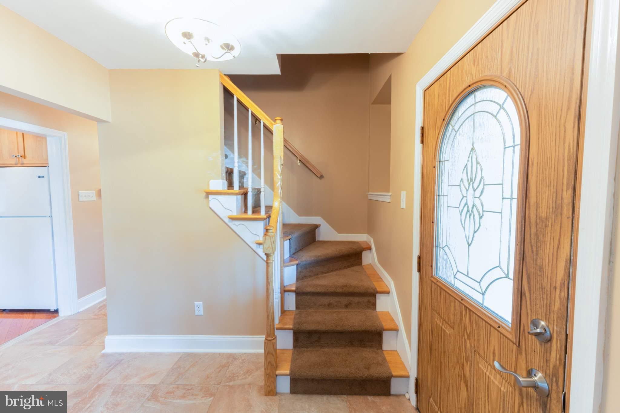 404 Langford Road Broomall, PA 19008 - Photo 5 of 40 a view of entryway and hall with wooden floor