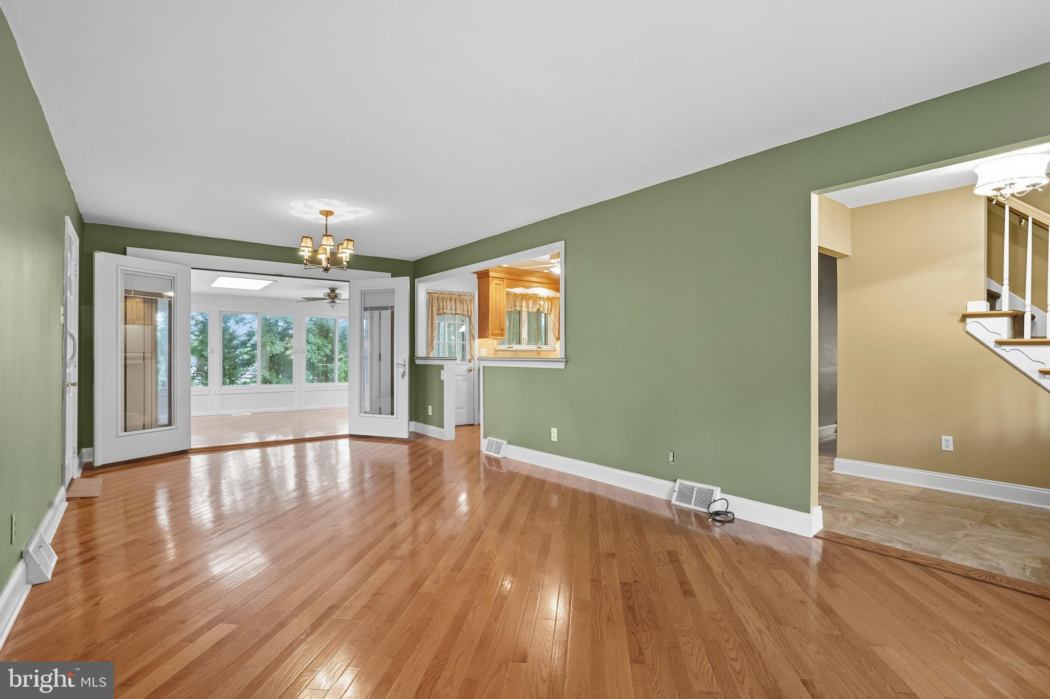 404 Langford Road Broomall, PA 19008 - Photo 8 of 40 a view of an empty room with wooden floor and a window