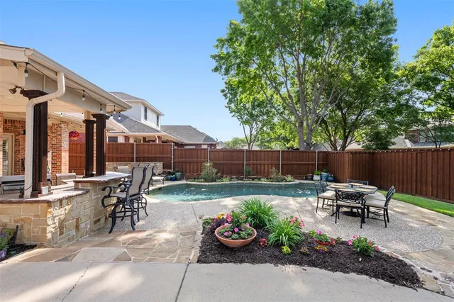 a view of a patio with chair and tables