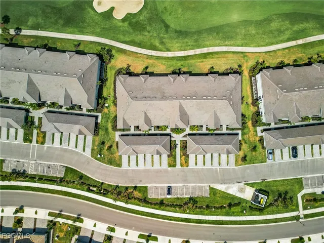 a view of swimming pool with a yard and plants