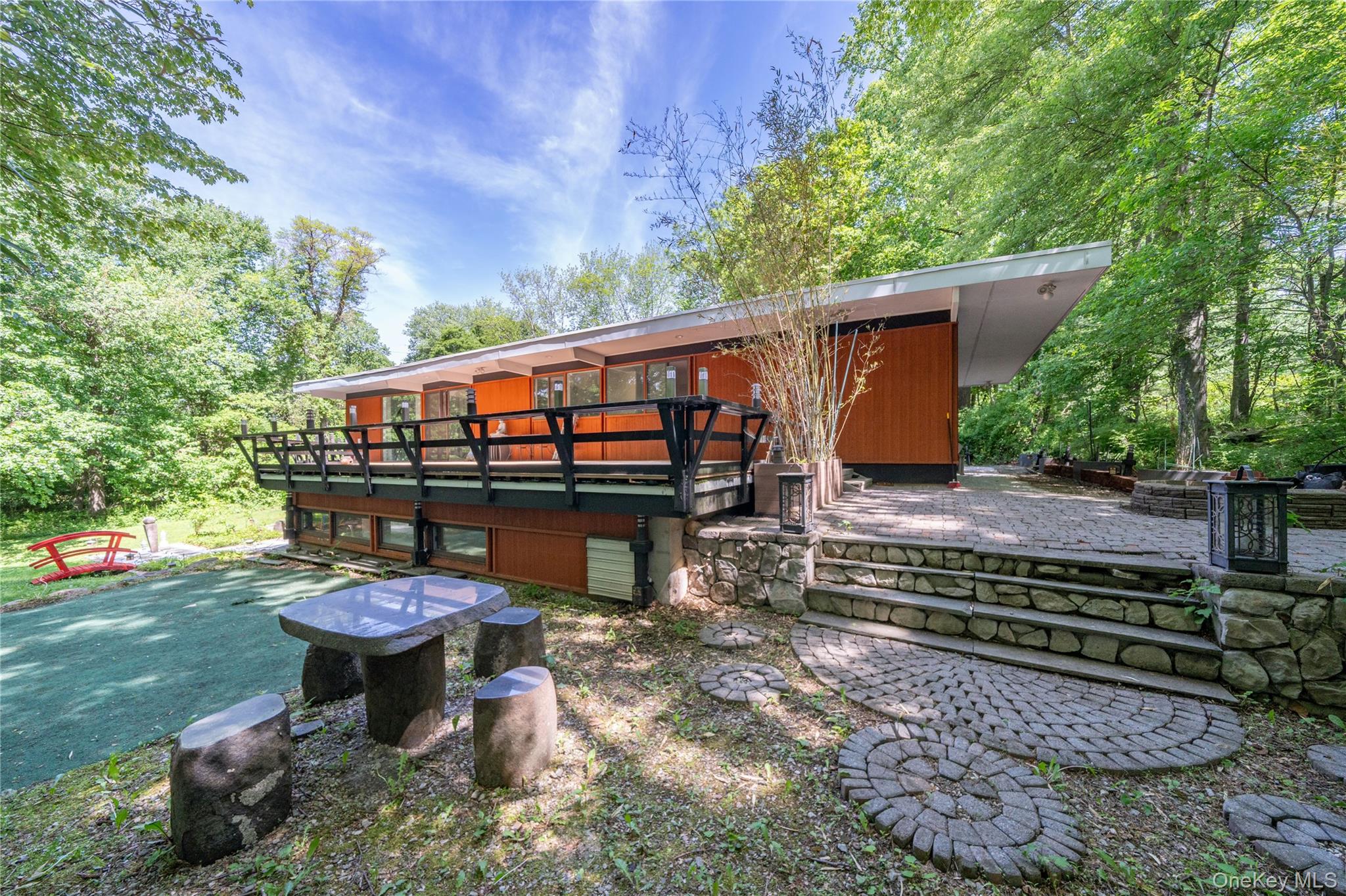 4 Half Mile Road Armonk, NY 10504 - Photo 26 of 28 A rare blend of mid century modern design and serene retreat-like surroundings in a peaceful natural setting.