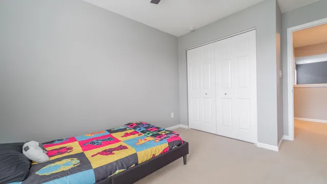 a bedroom with a bed and a closet