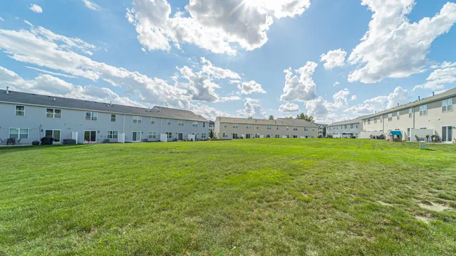 a view of a house with a big yard
