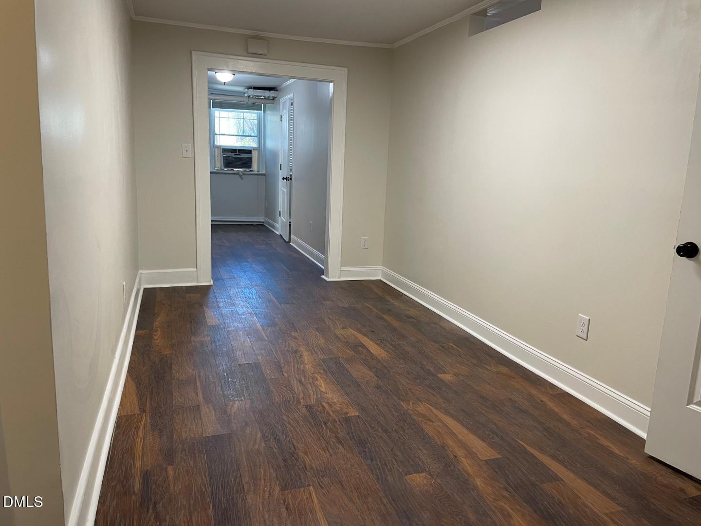 200 East Edenton Street, Unit 11 Raleigh, NC 27601 - Photo 3 of 9 a view of a room with wooden floor