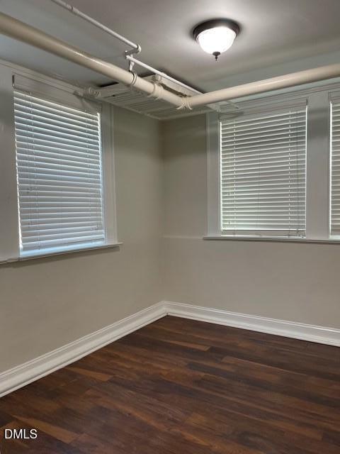 200 East Edenton Street, Unit 11 Raleigh, NC 27601 - Photo 7 of 9 a view of an empty room with wooden floor and a window