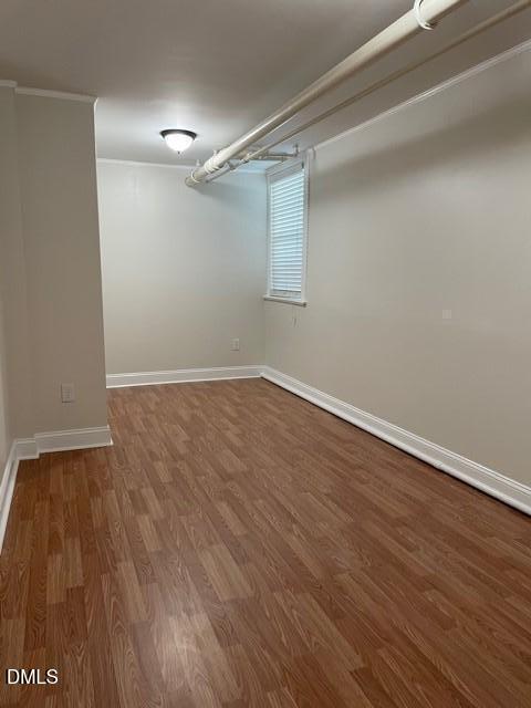200 East Edenton Street, Unit 11 Raleigh, NC 27601 - Photo 9 of 9 a view of an empty room with wooden floor and a window