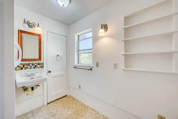 a room with a cabinets and window