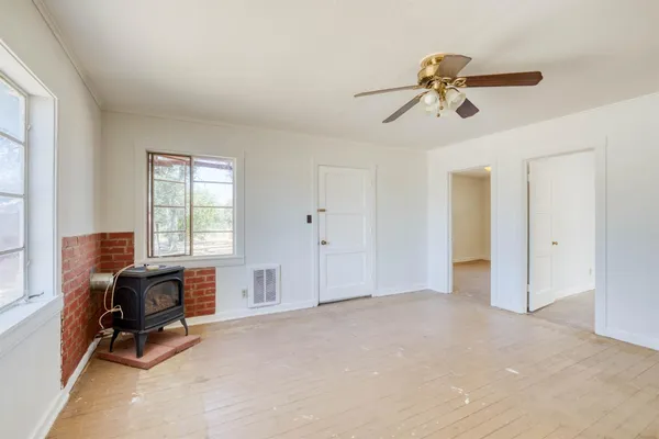 a view of room with workspace and windows