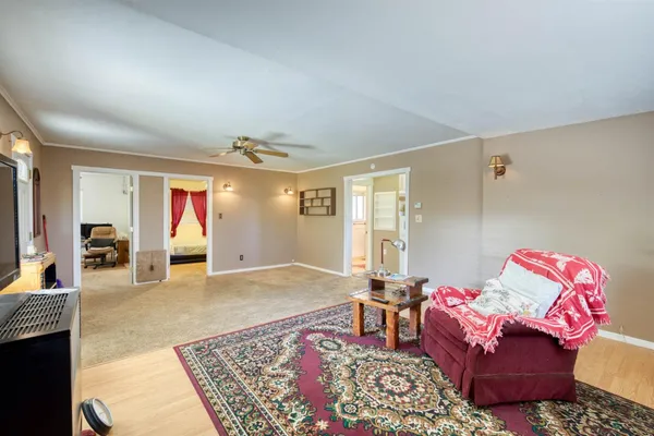 a living room with furniture and a rug