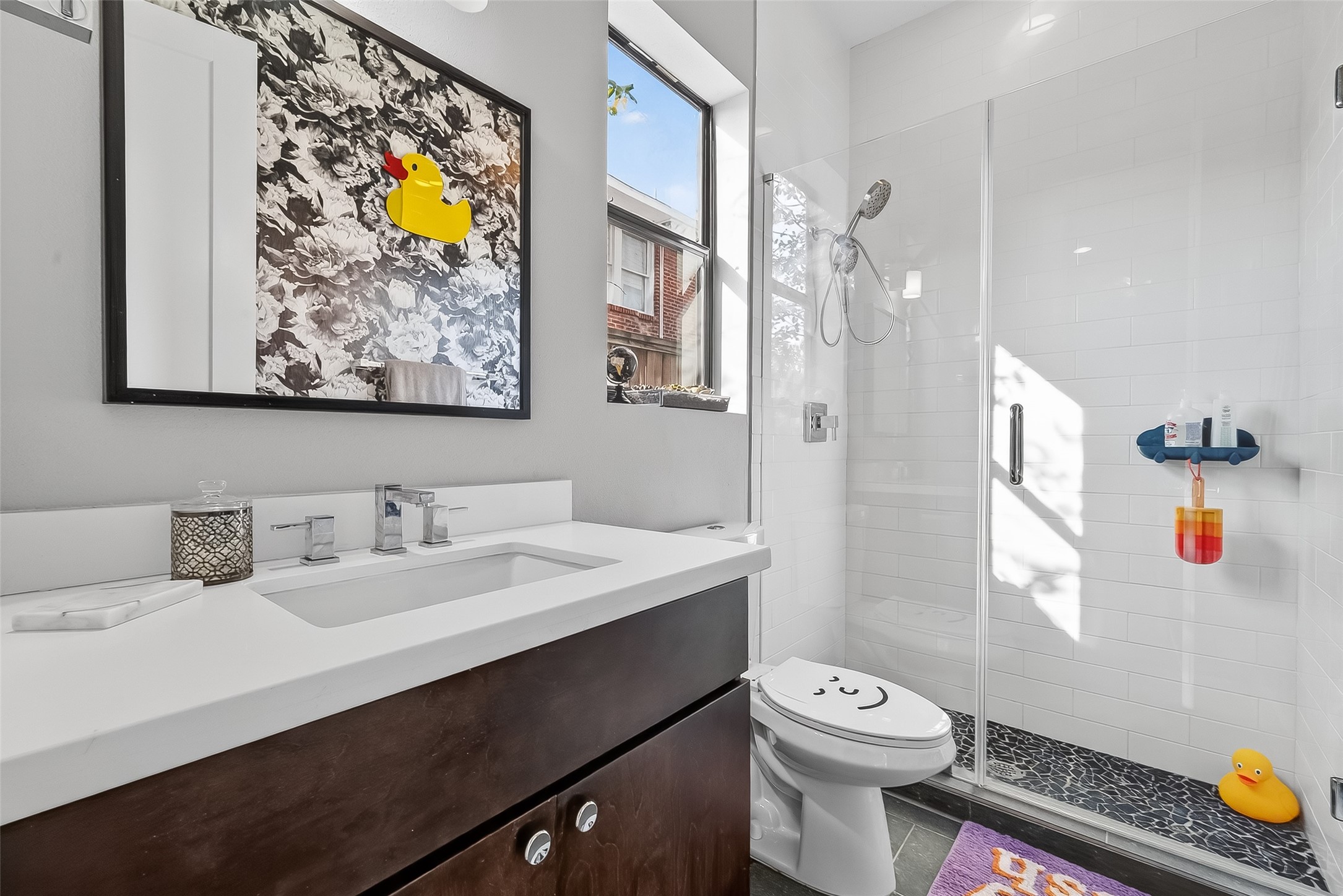606 Pacific Street Houston, TX 77006 - Photo 23 of 41 a bathroom with a sink a toilet and shower
