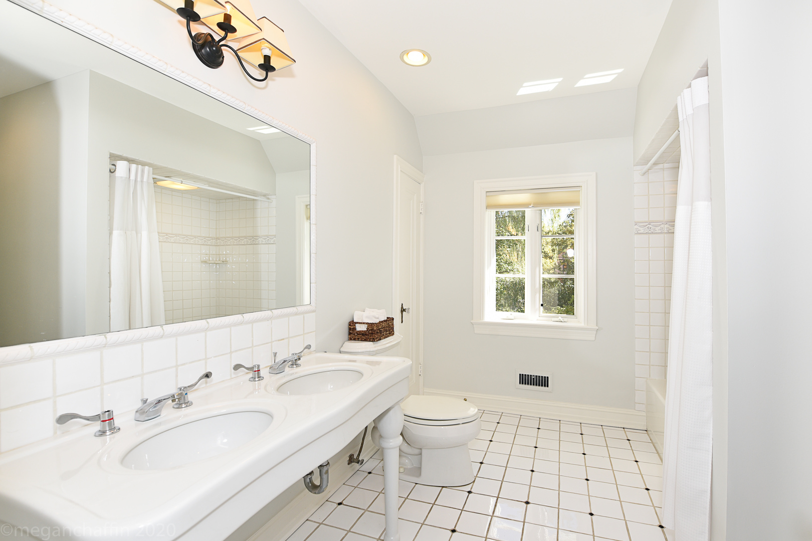 825 Sheridan Road Glencoe, IL 60022 - Photo 24 of 40 a bathroom with a sink a toilet and a mirror