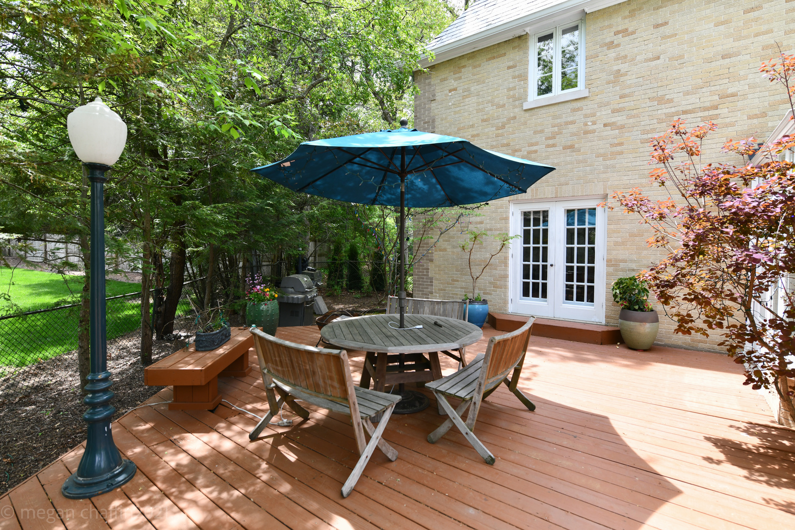 825 Sheridan Road Glencoe, IL 60022 - Photo 35 of 40 a view of a patio with a table and chairs under an umbrella