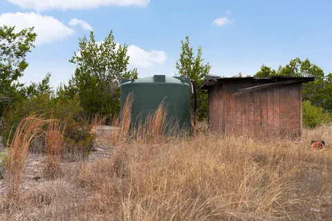 an aerial view of residential building with parking space