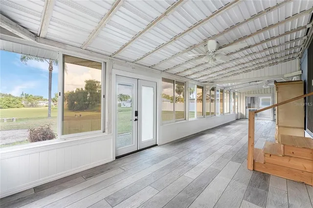 a view of an entryway with wooden floor