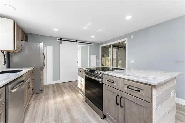 a kitchen with a stove oven and sink