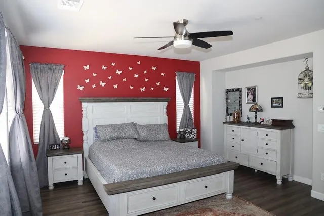 a living room with furniture and a dresser