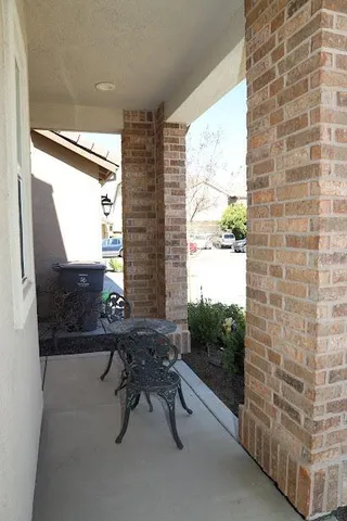 a reading room with furniture and a window