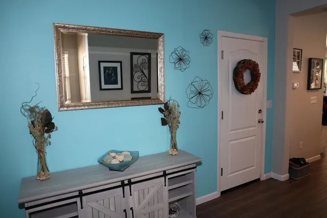 a view of entryway with livingroom and wooden floor